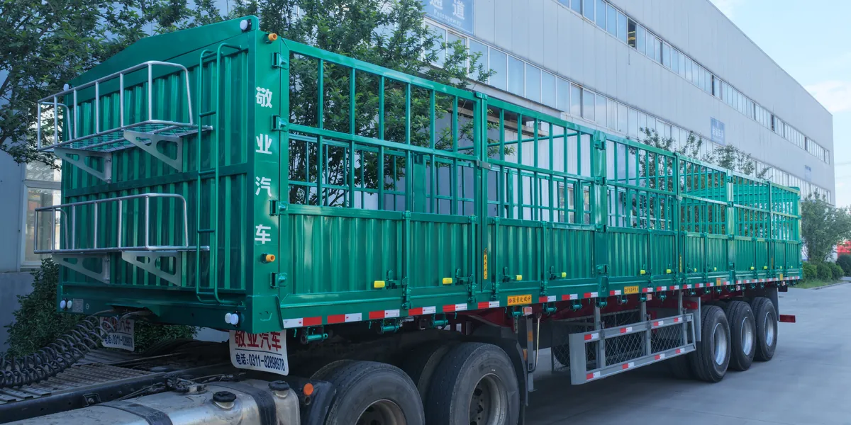 Fence semi trailer at the plant seen from the rear quarter
