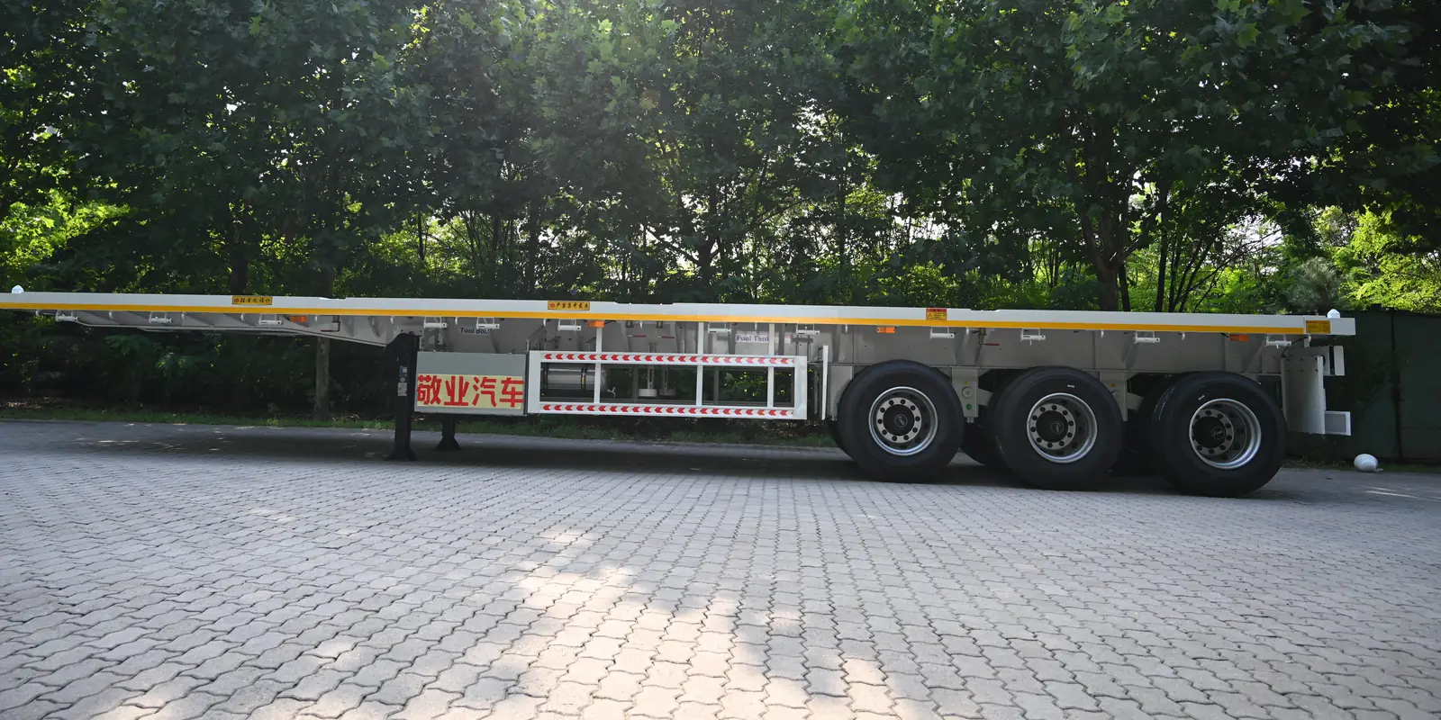 40 ft flatbed semi trailer, full side view on three axles